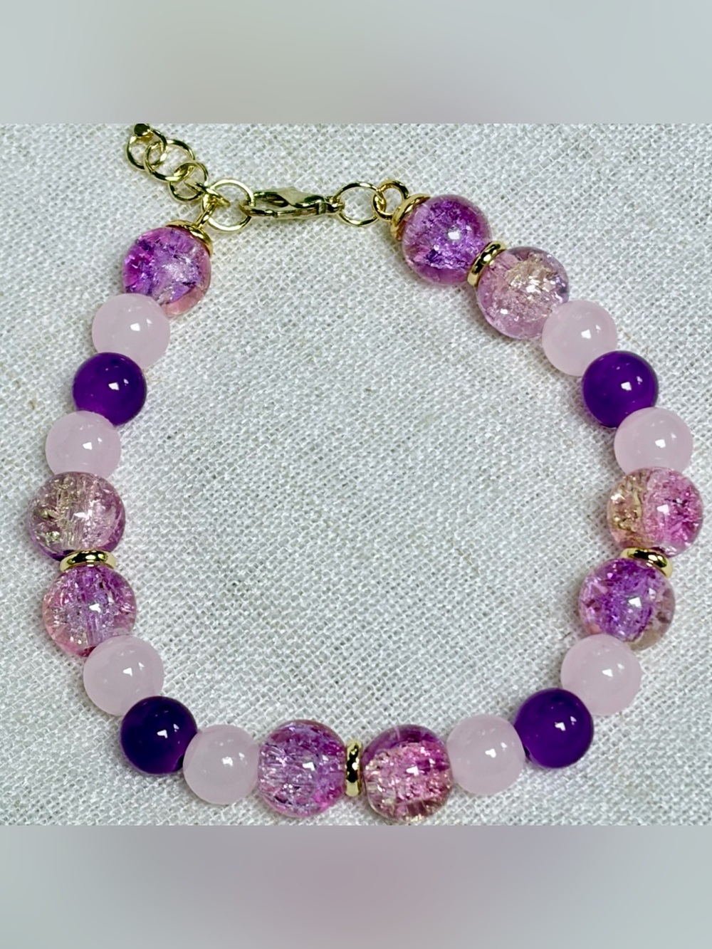 Delicate bracelet-crackled glass beads,pink,purple beads,gold filled spacers.New